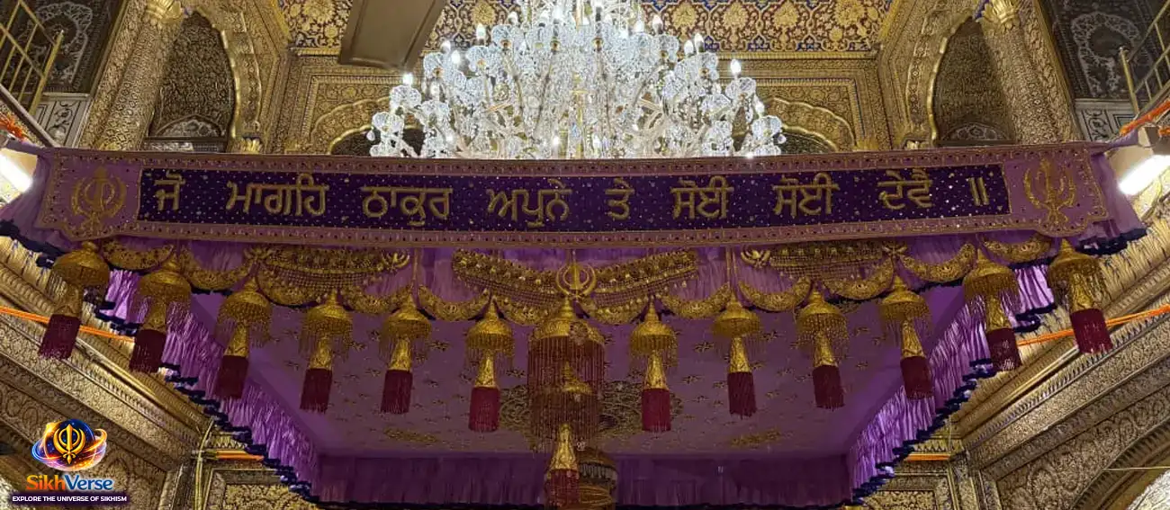 Punjabi Gurbani quote ‘Jo Mageh Thakur Apne Te Soi Soi Devai’ written on decorative palki inside Golden Temple Amritsar with chandelier and golden interior